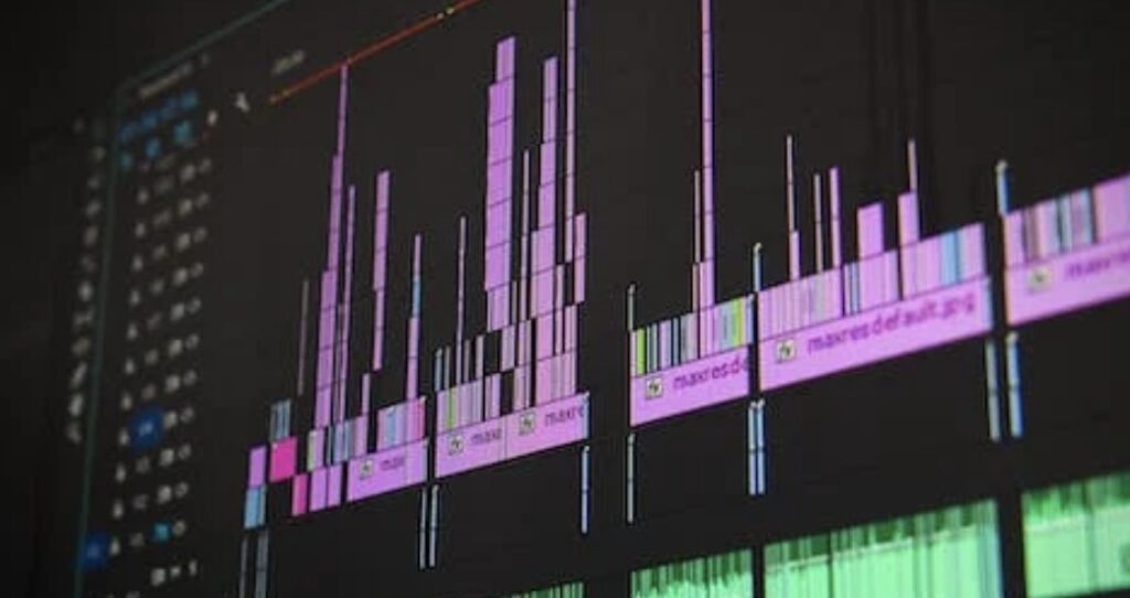 **Alt Text:** A close-up of an audio editing software interface displaying various tracks with purple waveforms.