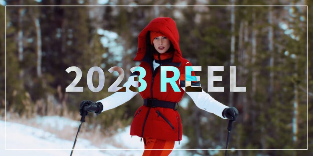 A person dressed in red winter sports attire stands in a snowy forest with ski poles, with "2023 REEL" text overlaying the image.