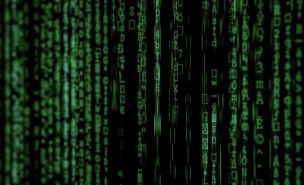 A black screen filled with vertical streams of green alphanumeric characters resembling code.