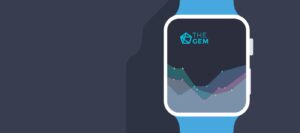 **Alt Text:** A smartwatch displays a line graph with the text "The Gem" on a dark background.