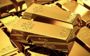 **Alt text:** A pile of shiny gold bars, each marked with "999.9" indicating their fineness.