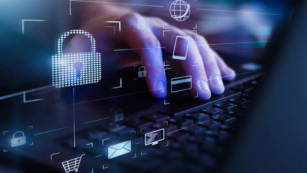 A person's hand typing on a laptop keyboard with digital security icons, such as a padlock and envelope, overlayed on the image.