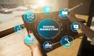 **Alt Text:** A digital marketing concept illustration showing a tablet with interconnected icons labeled "E-mail," "Advertising," "Content," "Viral," "SEO," "Analysis," "E-commerce," and "Social Media."