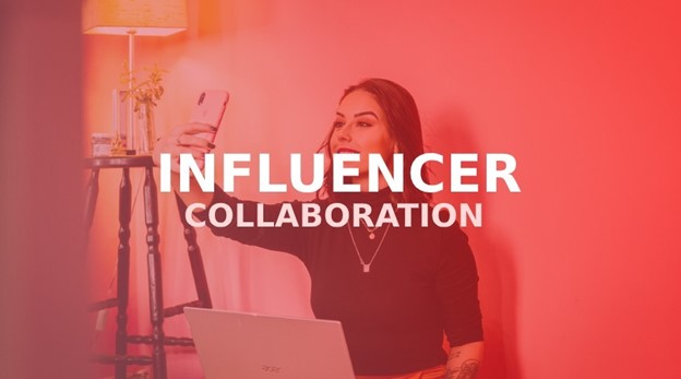 A woman holding a smartphone takes a selfie in a room with red lighting, with the words "INFLUENCER COLLABORATION" overlaid.