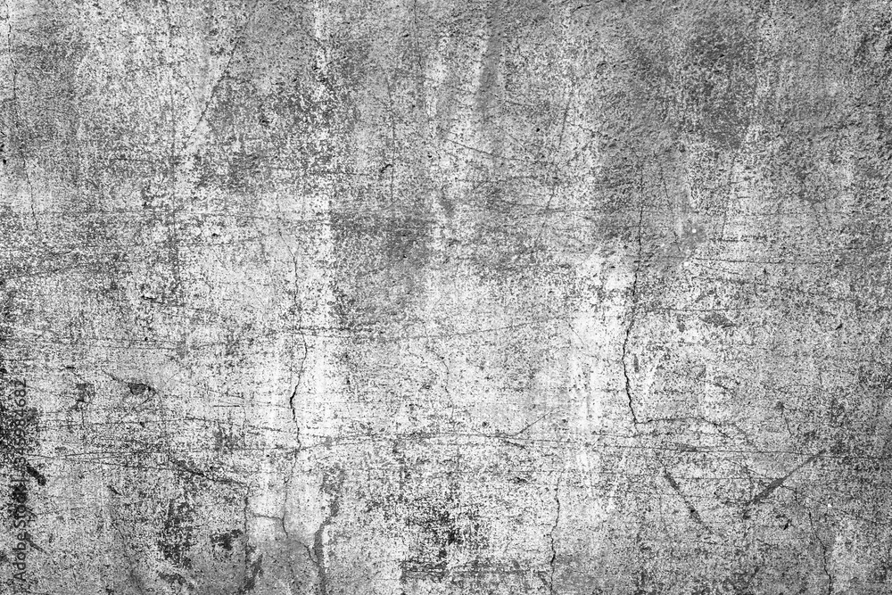 **Alt Text:** A textured, cracked, grayscale concrete wall with visible scratches and wear.