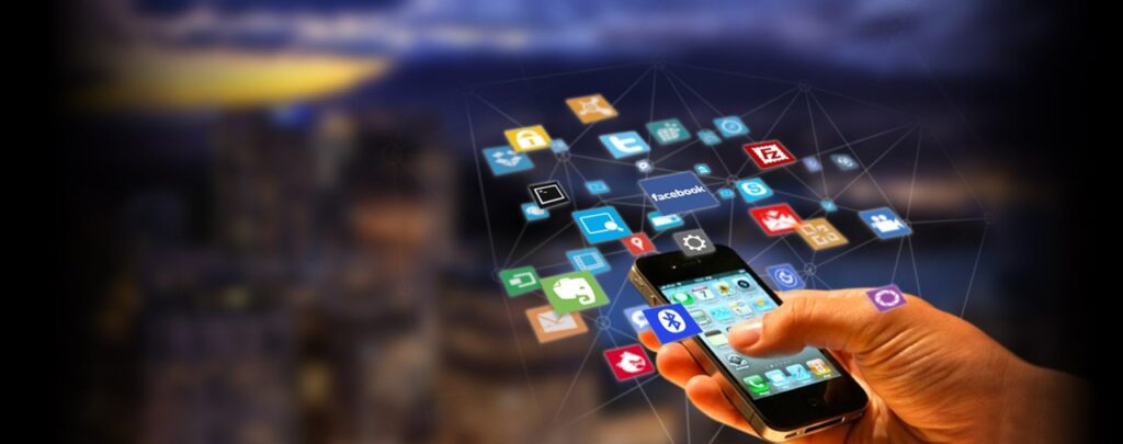 **Alt text:** A person holds a smartphone with various app icons floating above it against a blurred cityscape background.