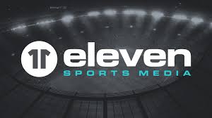 The image displays the Eleven Sports Media logo featuring a stylized "11" icon followed by the words "eleven SPORTS MEDIA" on a dark stadium background.