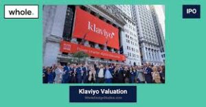 A group of people stands in front of the New York Stock Exchange with a large "Klaviyo" banner displayed, indicating an IPO event.