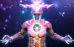**Alt text:** A digital image depicting a human figure with illuminated chakras, vibrant colors, and energy radiating from their head against a cosmic background.