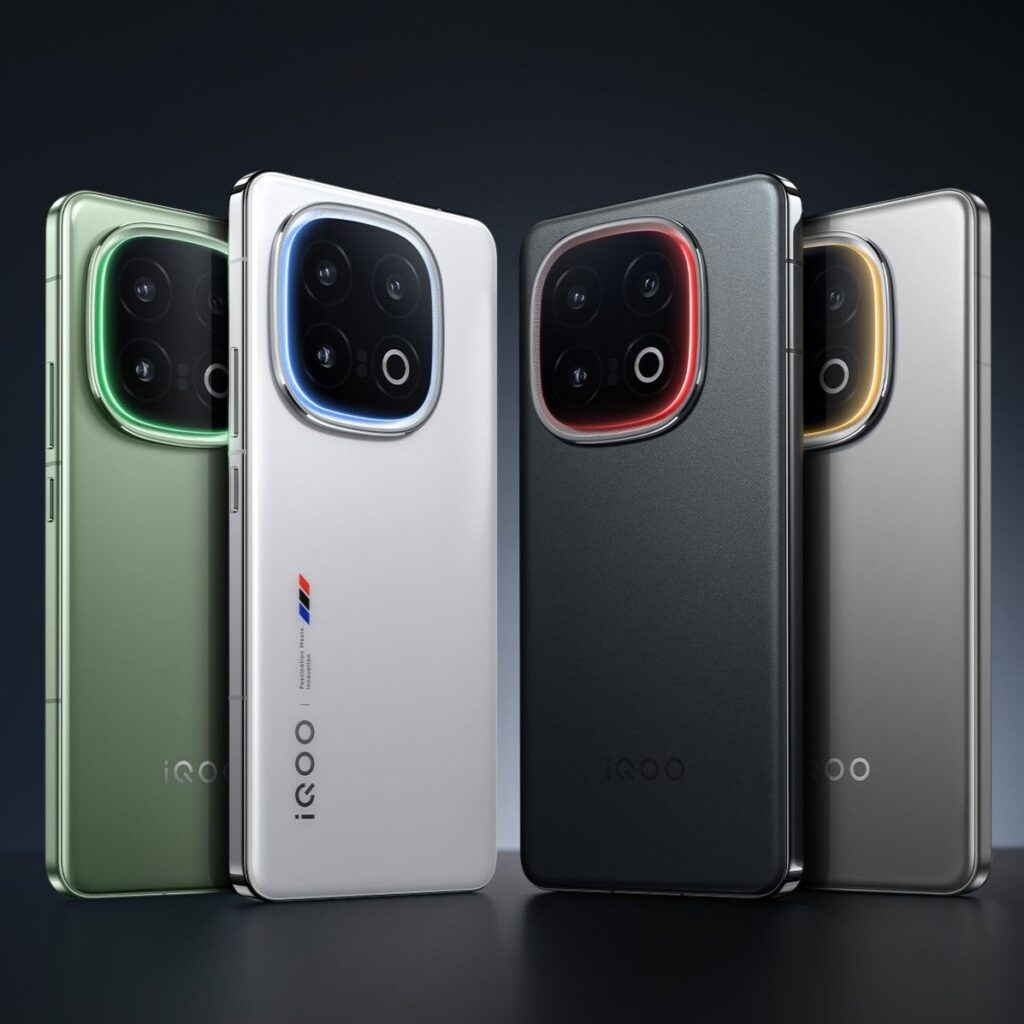 A lineup of four iQOO smartphones in green, white, black, and silver, each with colorful rings around their camera modules.