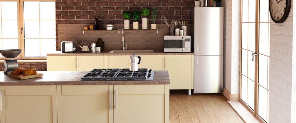 A modern kitchen with cream-colored cabinets, stainless steel appliances, and a brick accent wall.