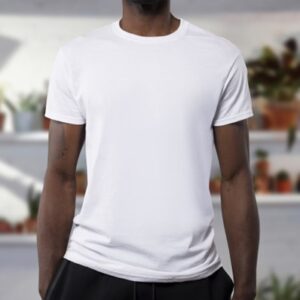 **Alt text:** A person wearing a plain white T-shirt standing against a blurred background with several potted plants.