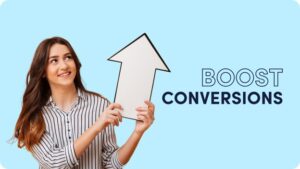 **Alt Text:** A woman in a striped shirt holds a large arrow pointing upward next to the text "BOOST CONVERSIONS" on a blue background.