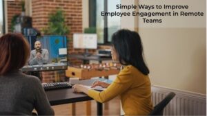 **Alt Text:** Two people are seated at a desk, participating in a video call with a man on the screen, in a modern office setting with a caption reading "Simple Ways to Improve Employee Engagement in Remote Teams."