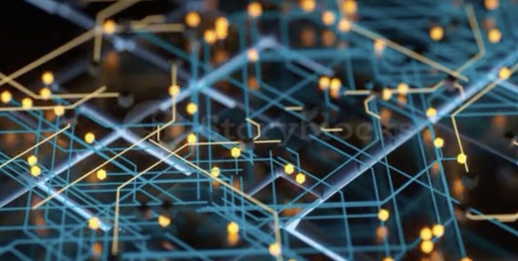 **Alt text:** A detailed close-up of a network of glowing yellow nodes connected by intricate blue lines, representing a digital circuit or neural network.